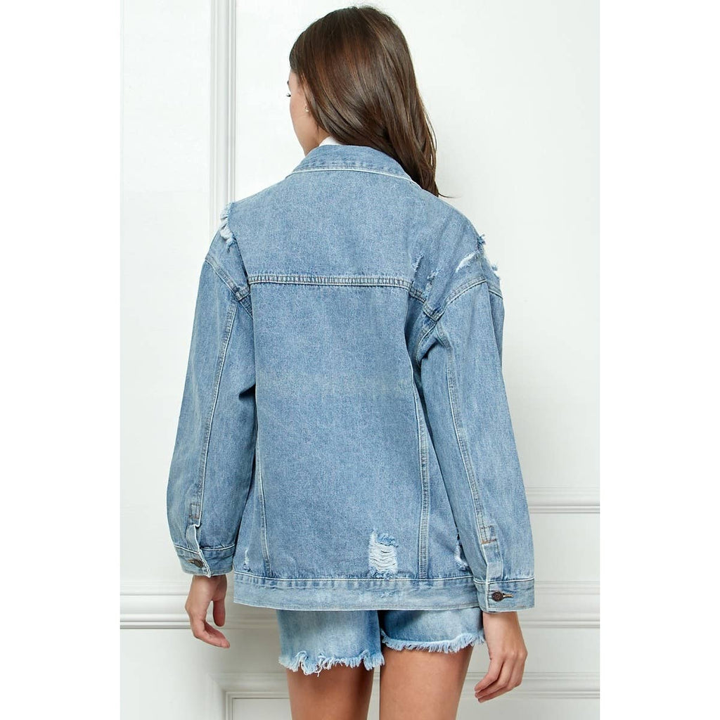 Medium-wash distressed denim jacket from back view with buttoned yoke and pockets
