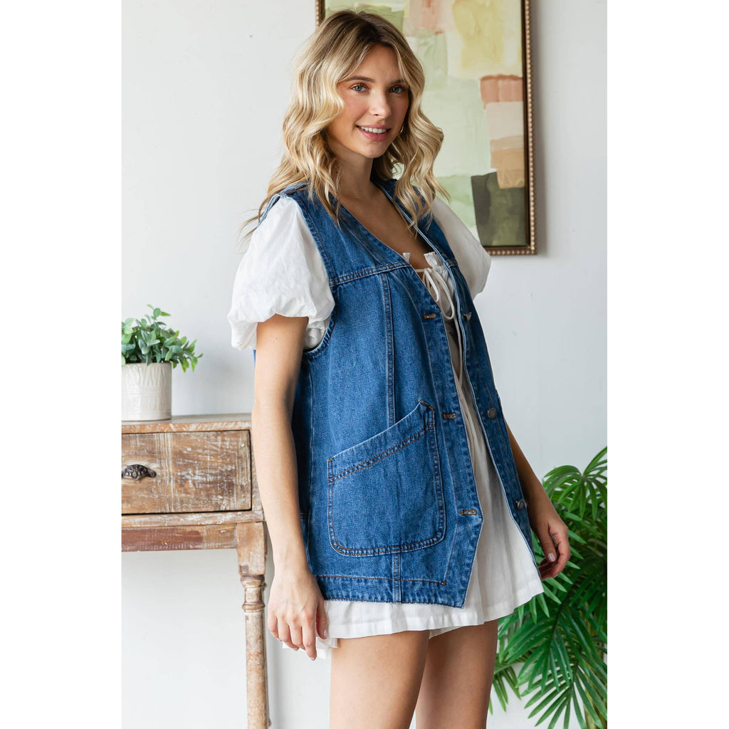 Sleeveless medium-wash denim vest with button front and large patch pocket