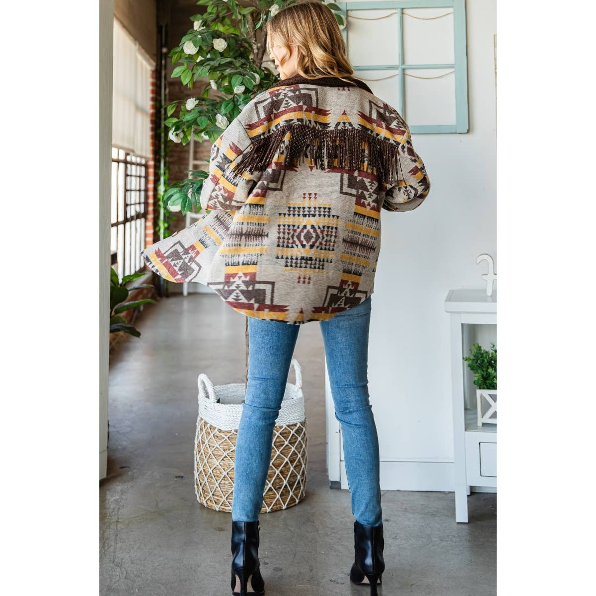 Taupe patterned thick knit shacket, back view with dark fringe along the yoke