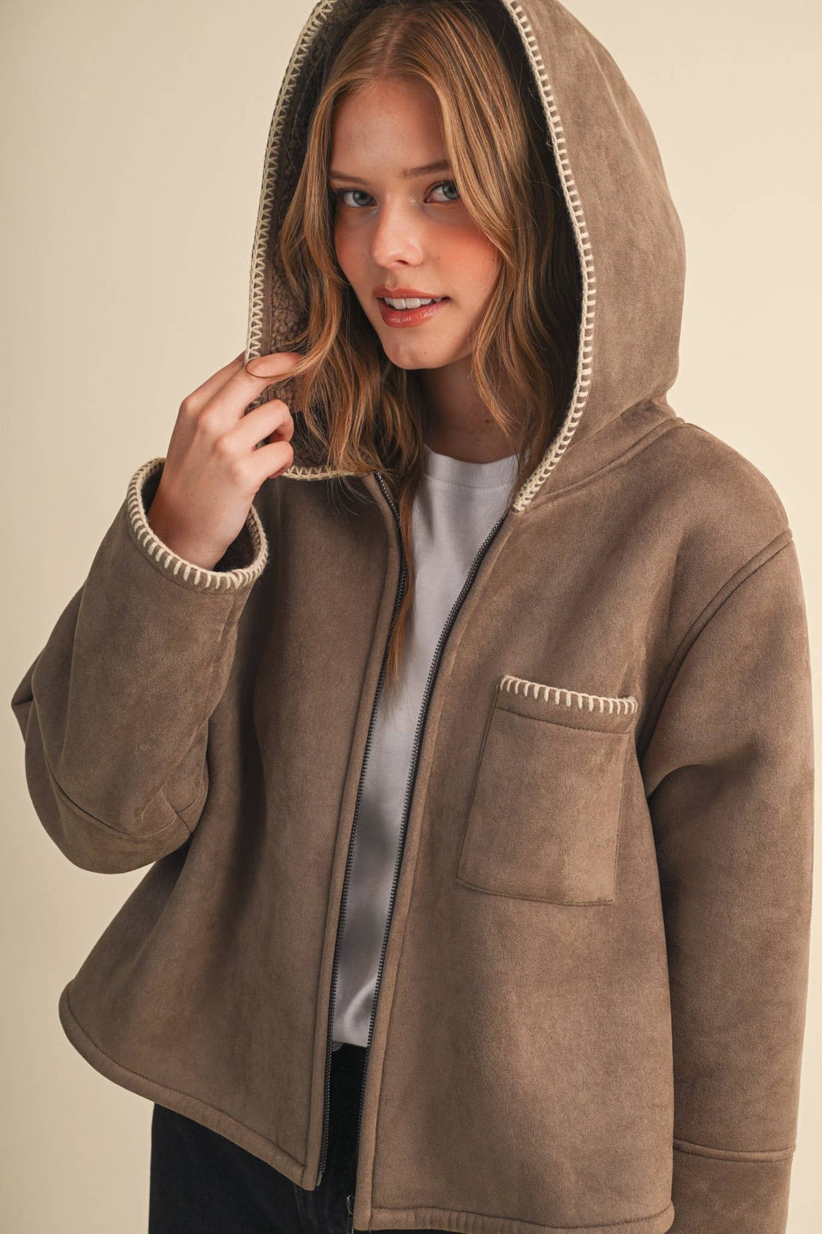 Taupe faux suede hooded jacket with zip front, sherpa lining, contrast blanket-stitch trim
