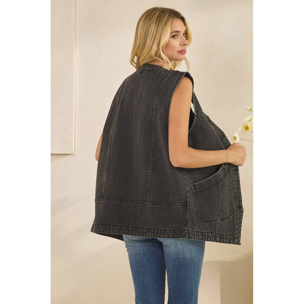 Dark denim sleeveless vest back view with patch pockets and stitched yoke