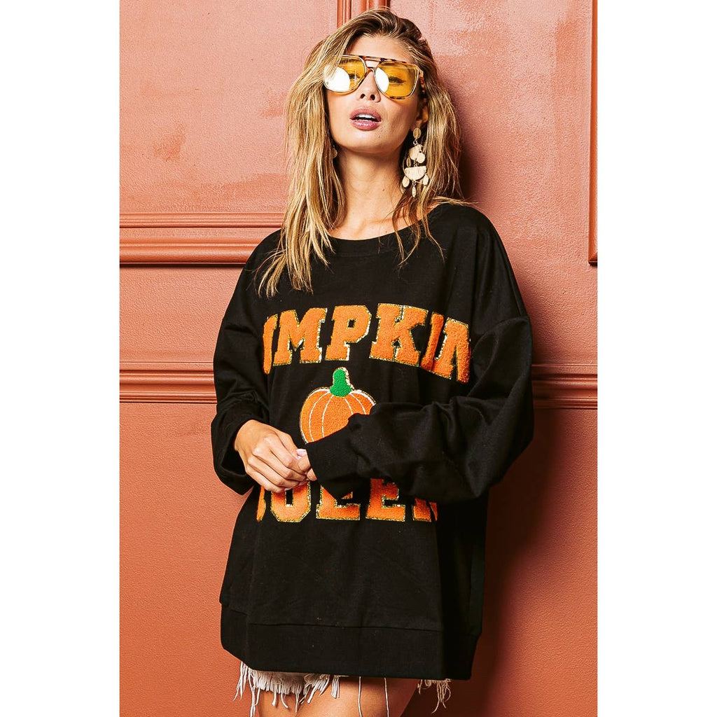 Black sweatshirt with large pumpkin and “Pumpkin Queen” graphic print, long sleeves