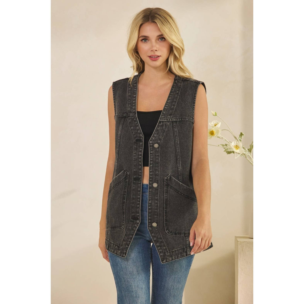 Dark wash denim sleeveless vest with V-neck and front button placket, side pockets