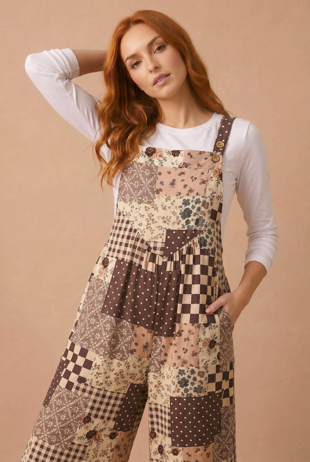 Brown floral patchwork wide-leg overalls with adjustable strap detail and patch panel legs