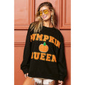 Black sweatshirt with orange "PUMPKIN QUEEN" lettering and pumpkin graphic