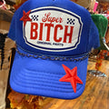 Blue baseball cap with oval 'Super BITCH' patch and red star accents