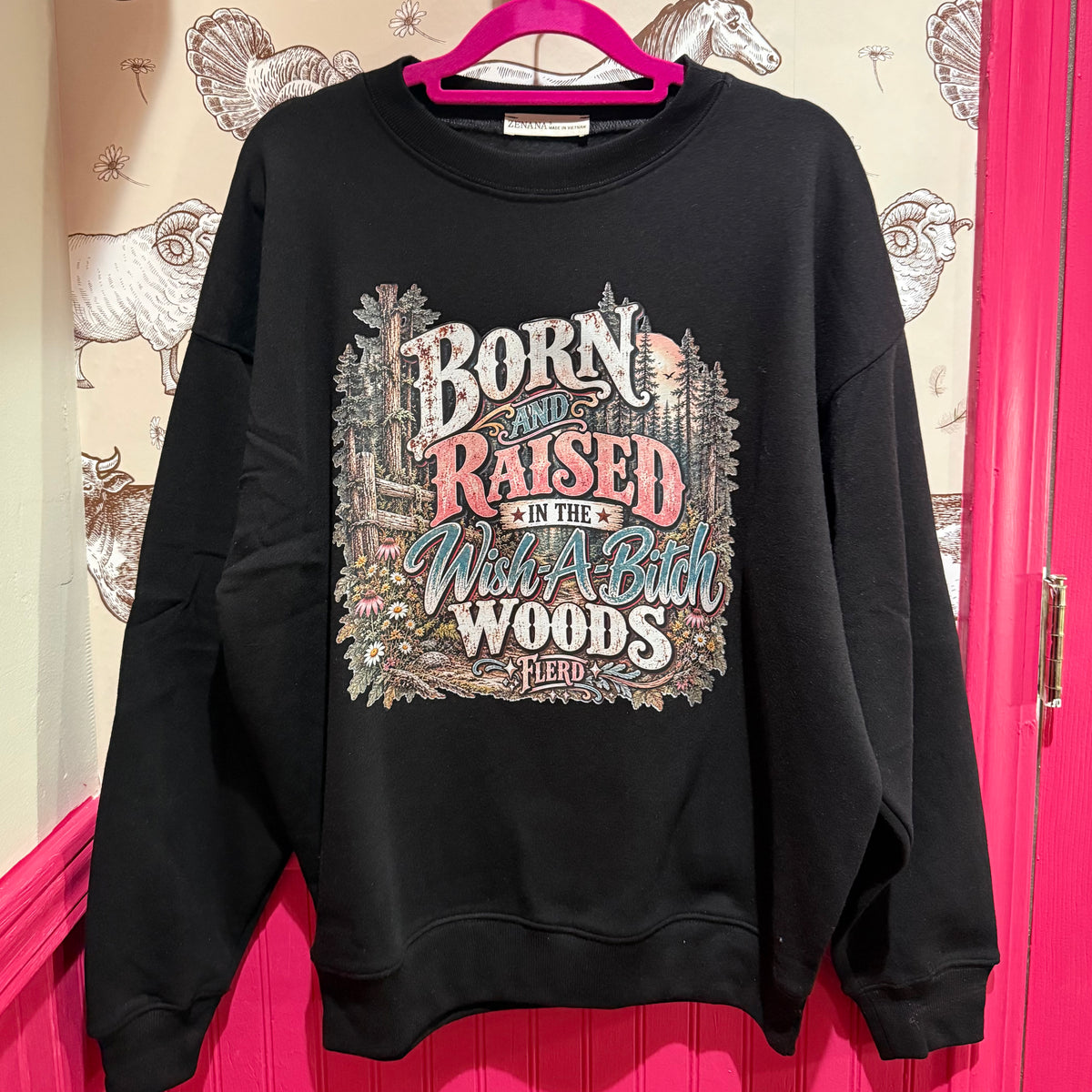 Black crewneck sweatshirt with large front text graphic and woodland scene