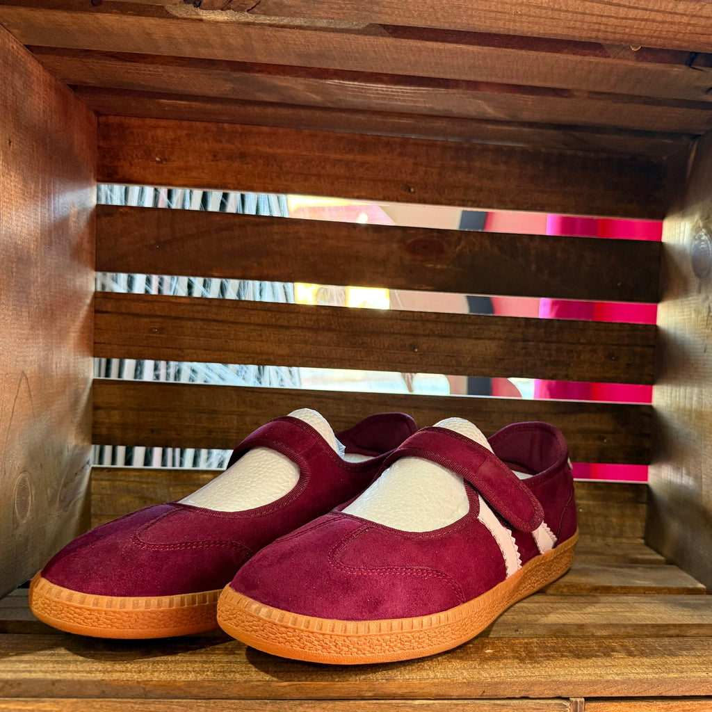 Burgundy suede slip-on shoes with hook-and-loop strap and tan cushioned sole