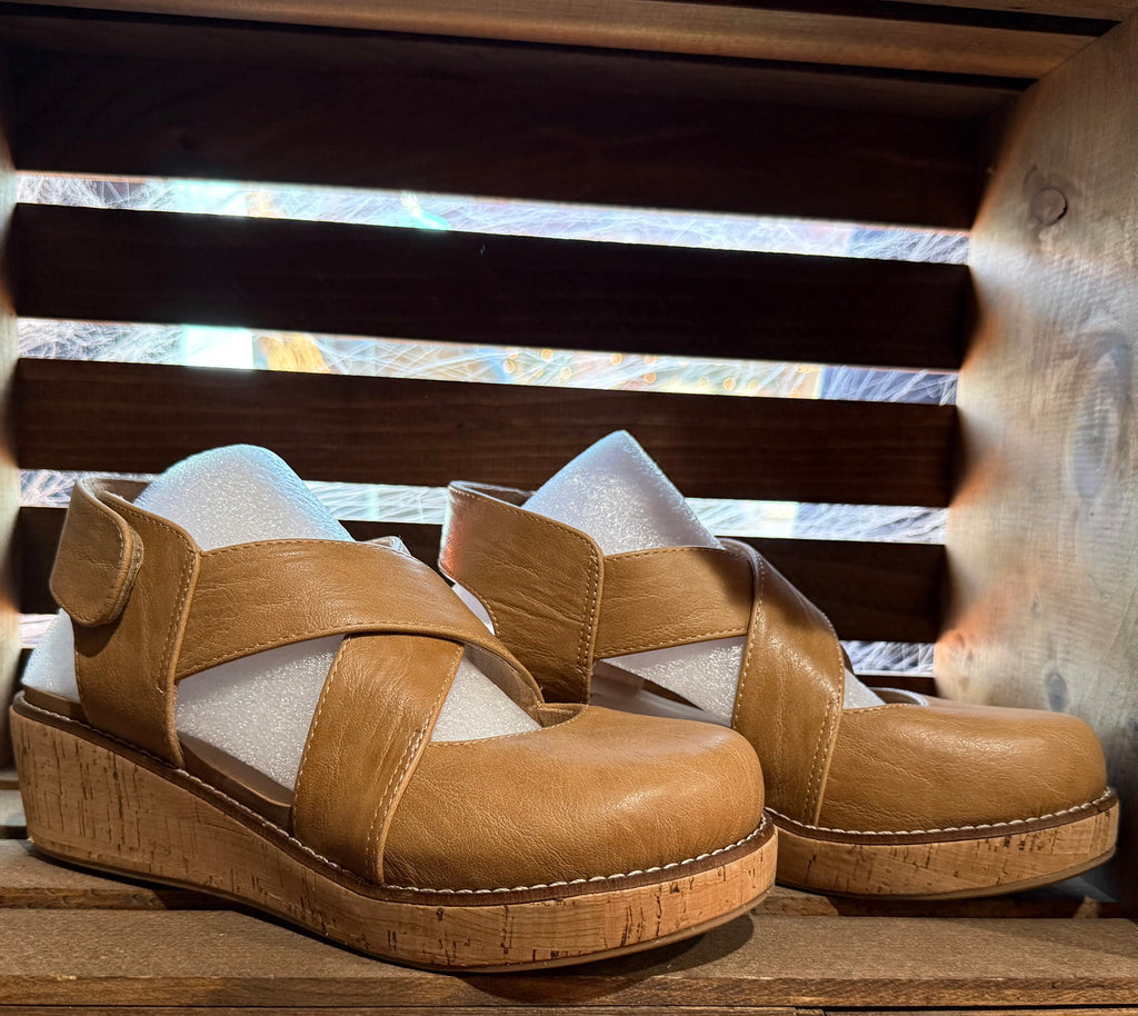 Tan leather wedge sandals with open toe straps and cork-style platform heel