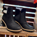 Black ankle boots with side zips, chunky block heels, and tan contrast sole trim