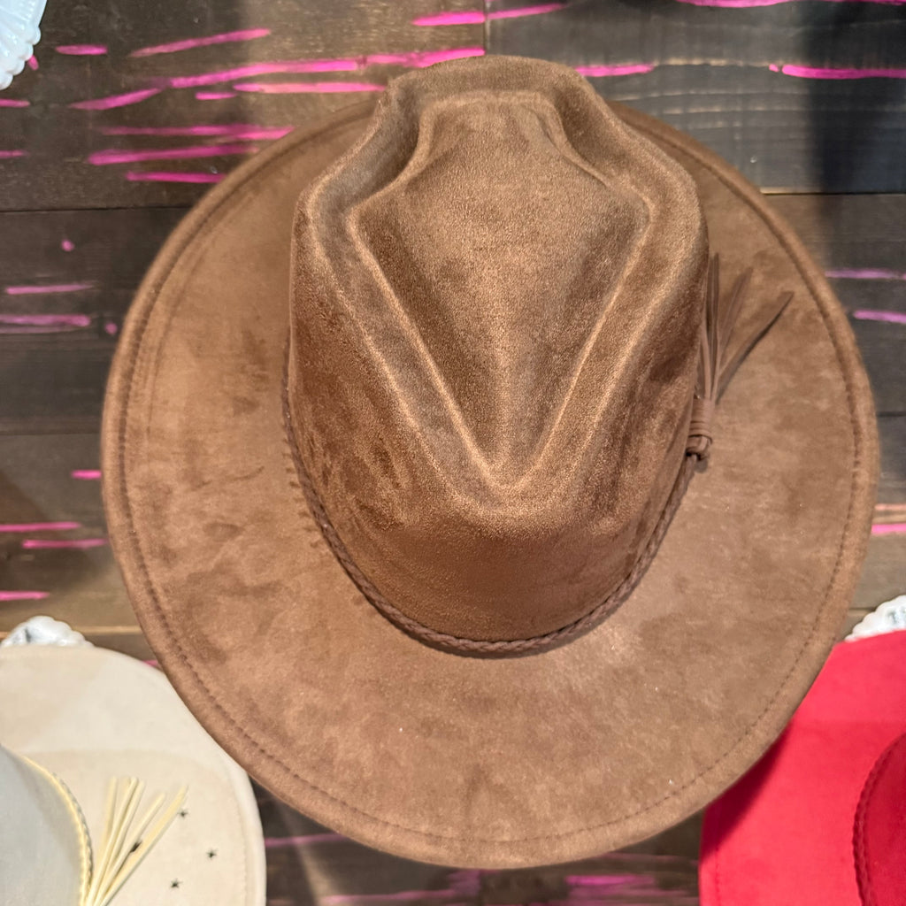 Dark brown arrow-shaped hat with wide brim and textured crown panel