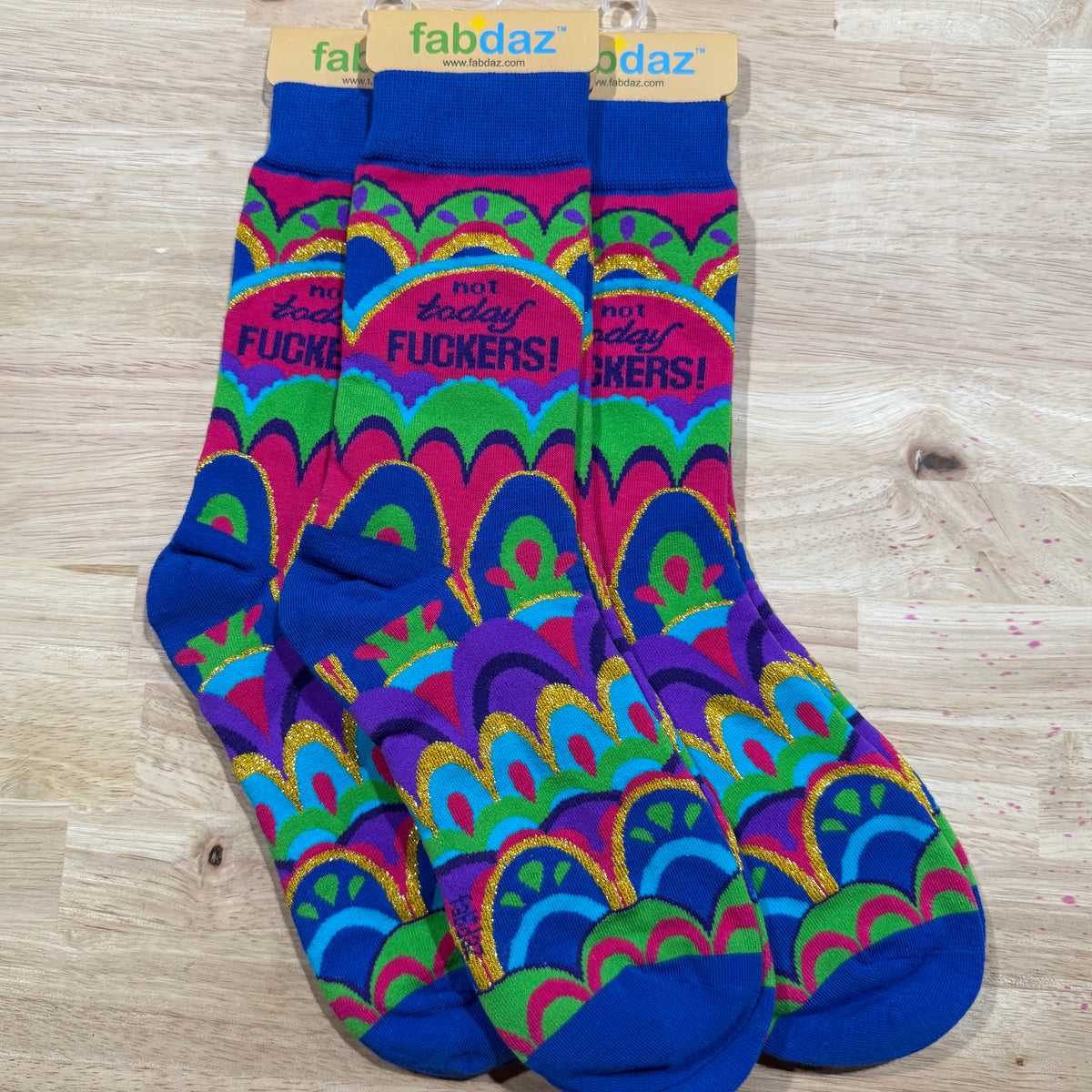 Blue and multicolor crew socks with “NOT TODAY FUCKERS!” and wave patterns
