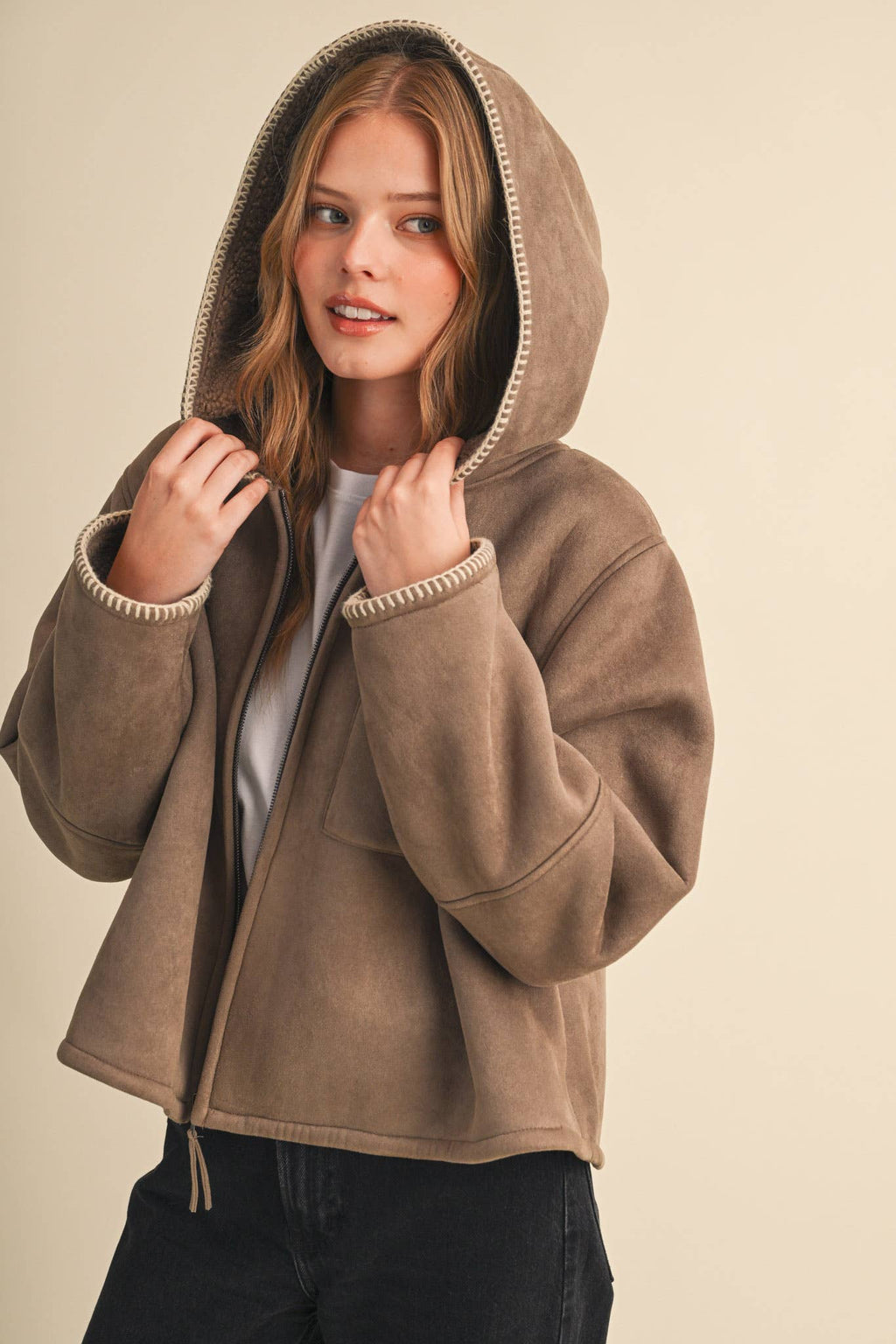 Taupe sherpa hooded jacket with zip front, front pockets, and contrast blanket-stitch trim