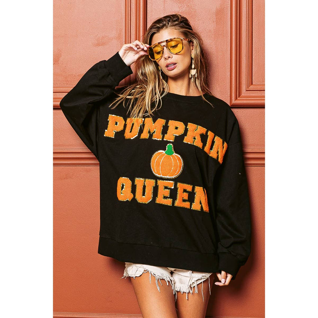 Black sweatshirt with orange "PUMPKIN QUEEN" and pumpkin graphic, long sleeves