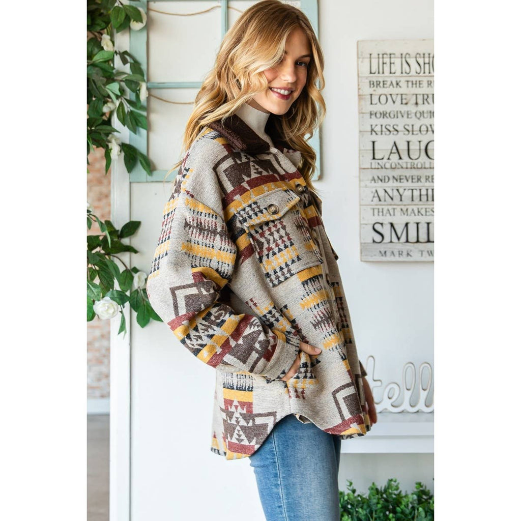 Taupe patterned thick knit shacket with stand collar, buttons, and statement fringe
