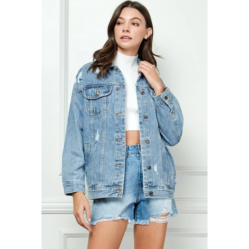 Distressed medium-wash denim jacket with button front and flap chest pockets