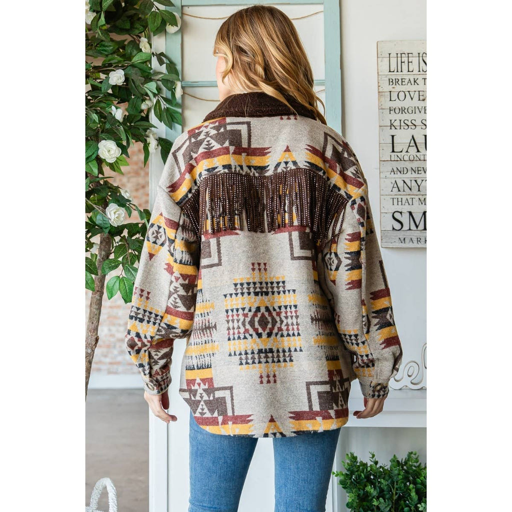 Taupe patterned thick knit shacket, back view with dark fringe across the yoke