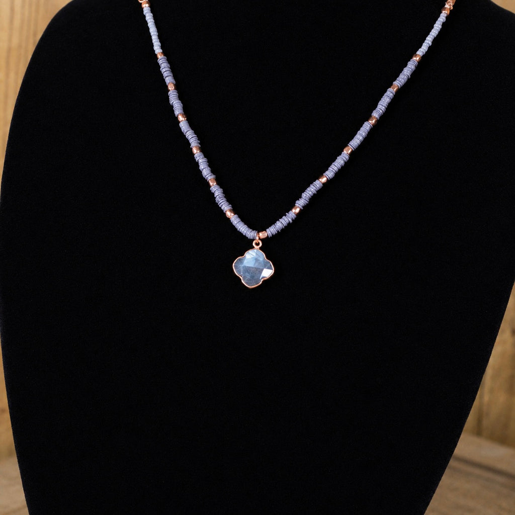Beaded quartz necklace featuring light-blue flower pendant on beaded chain