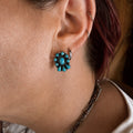 Turquoise flower cluster stud earrings with oval center and teardrop stones, silver-tone