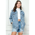 Distressed medium-wash denim jacket with button front and flap chest pockets